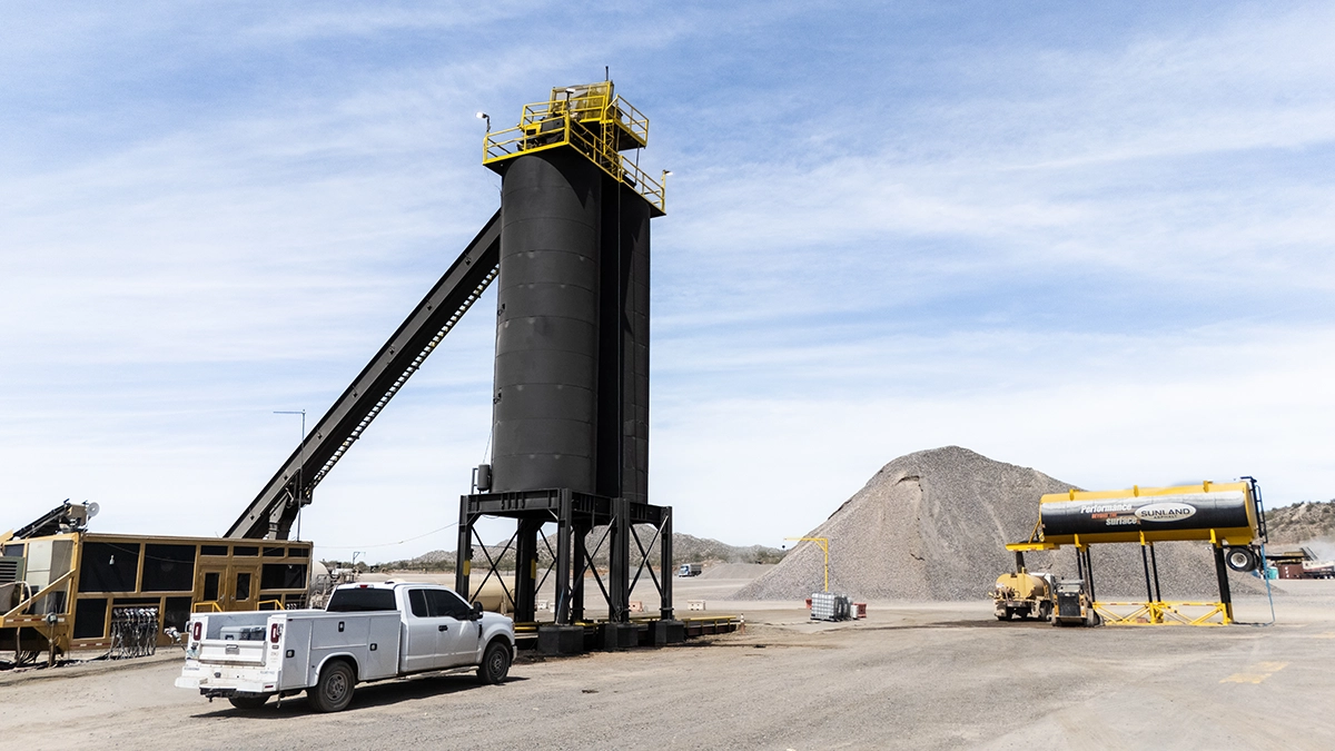 A truck next to a tower.